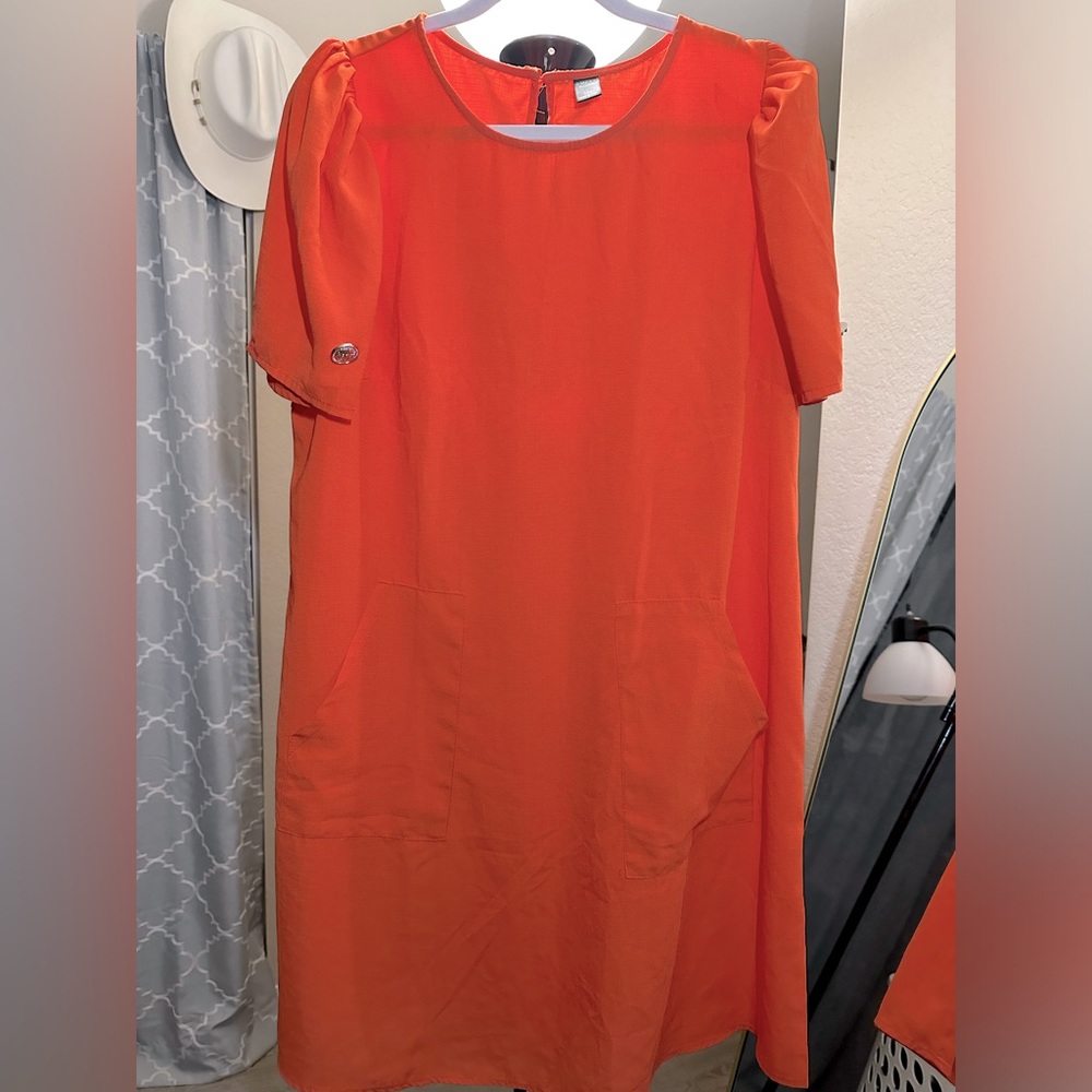 Women’s beautiful orange dress with pockets